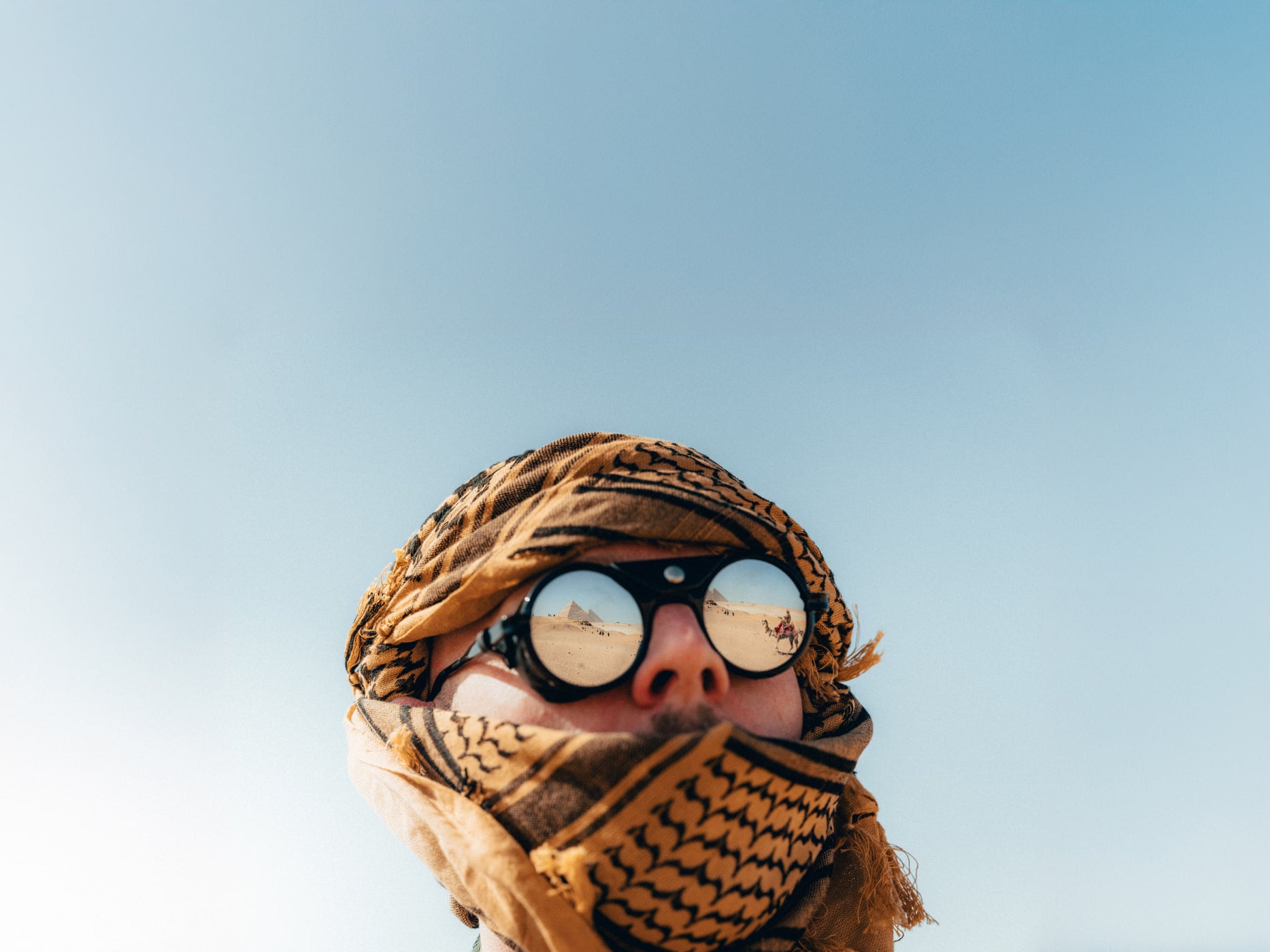 Max wrapped in a scarf and goggles in the Egyptian desert