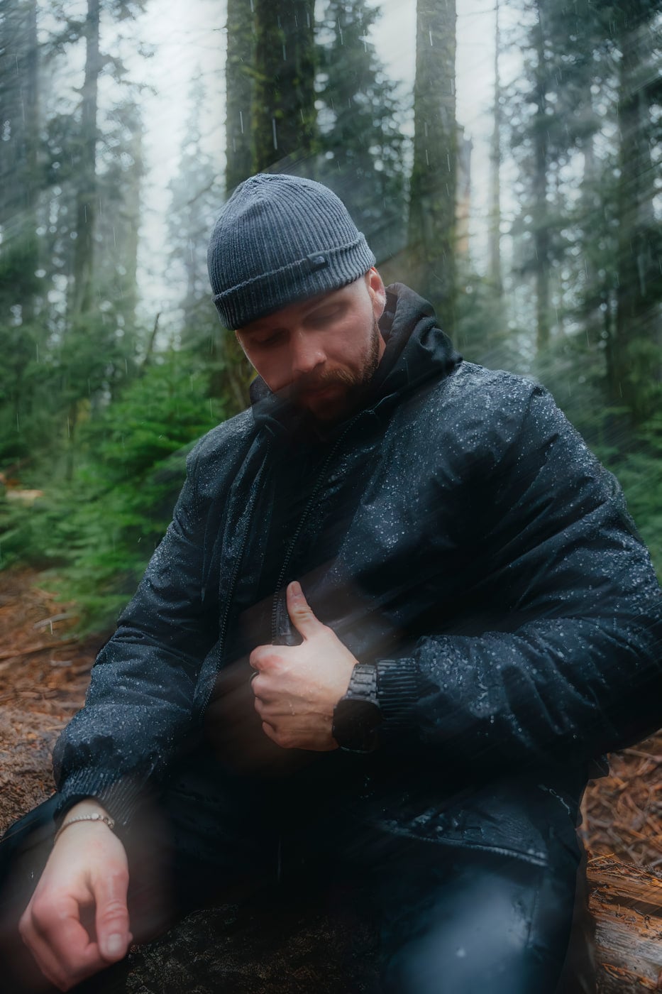 Max in a beanie in a rainy redwood forest