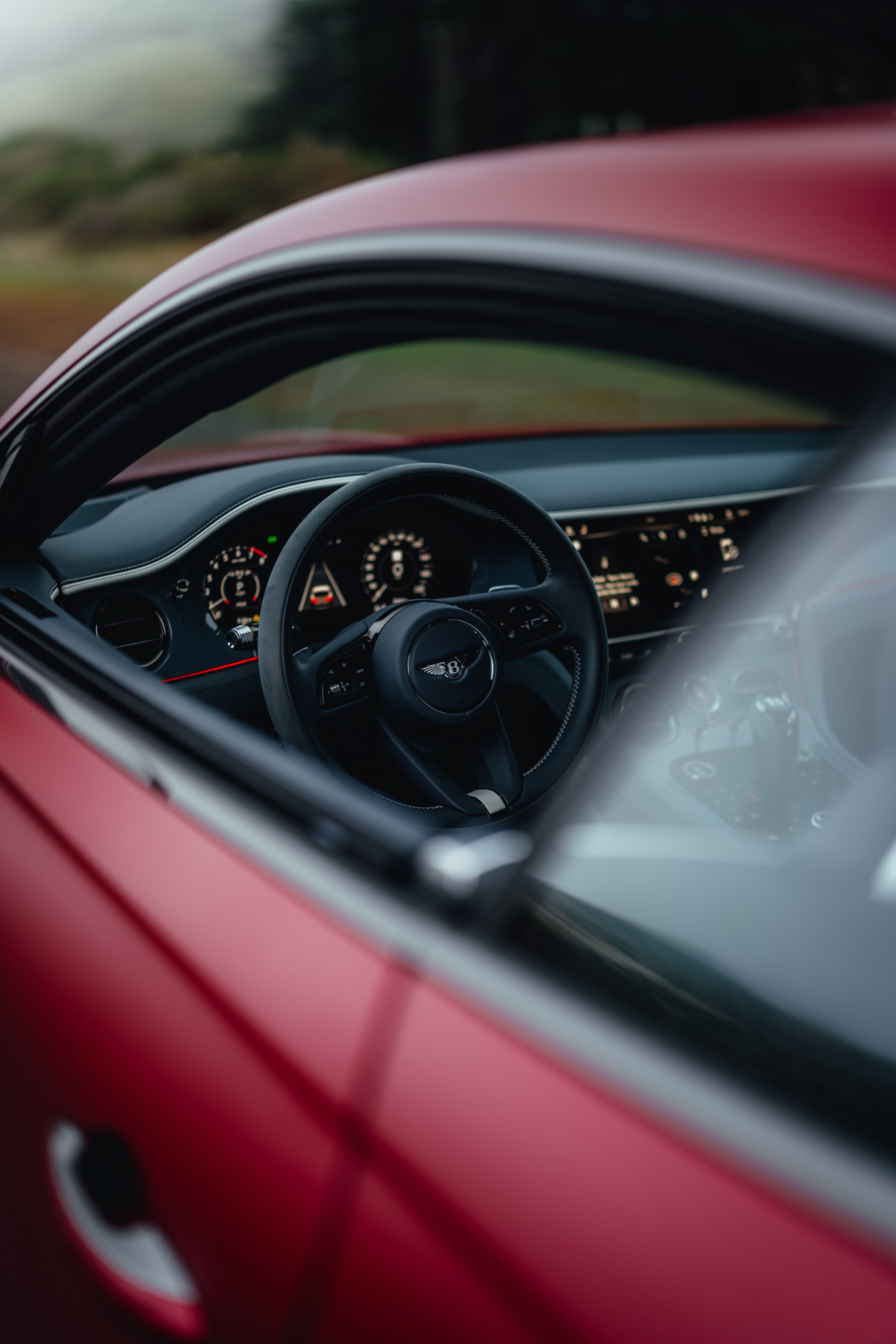 Continental GT interior — steering wheel through open window