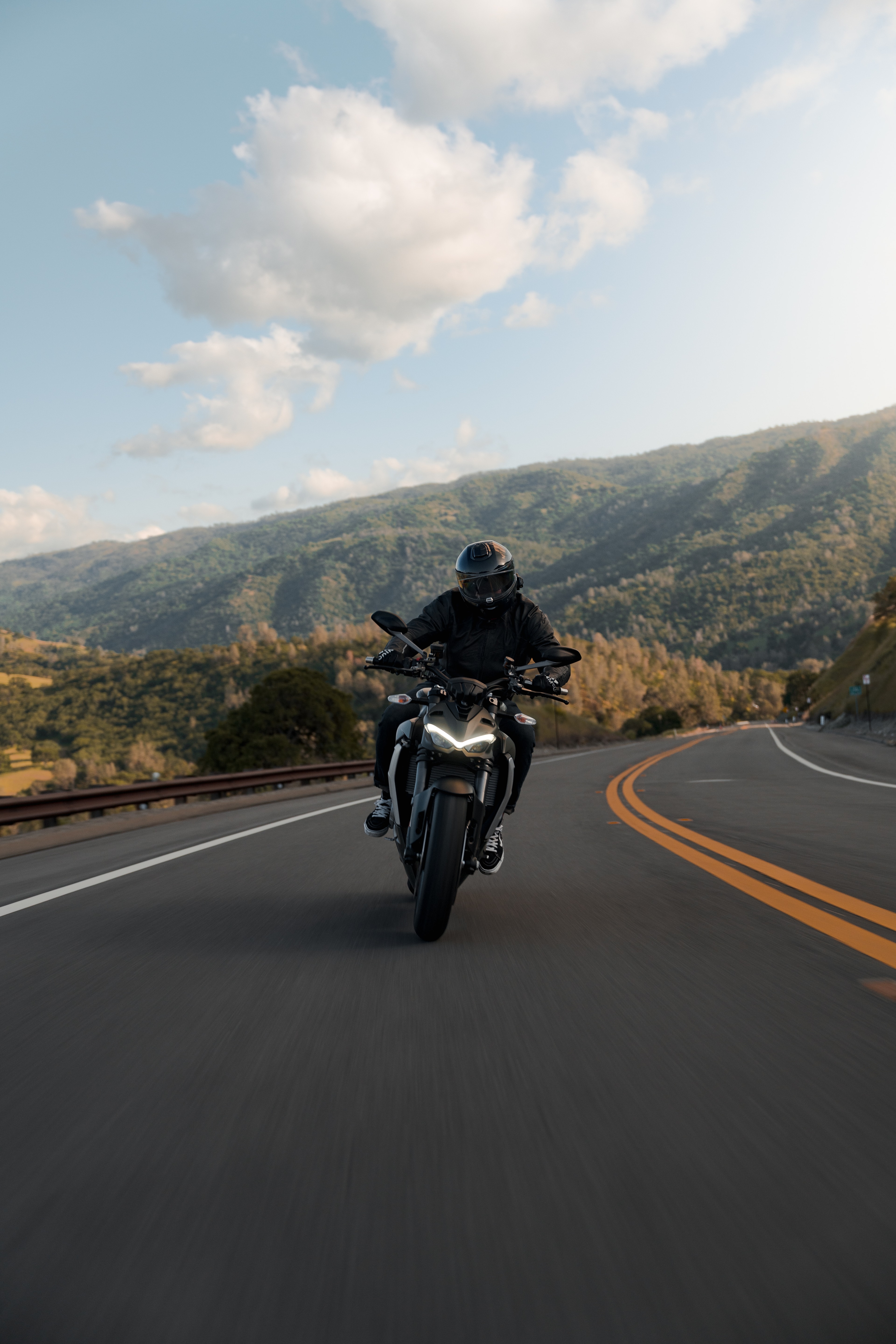 Ducati Street Fighter on a winding road through golden California hills