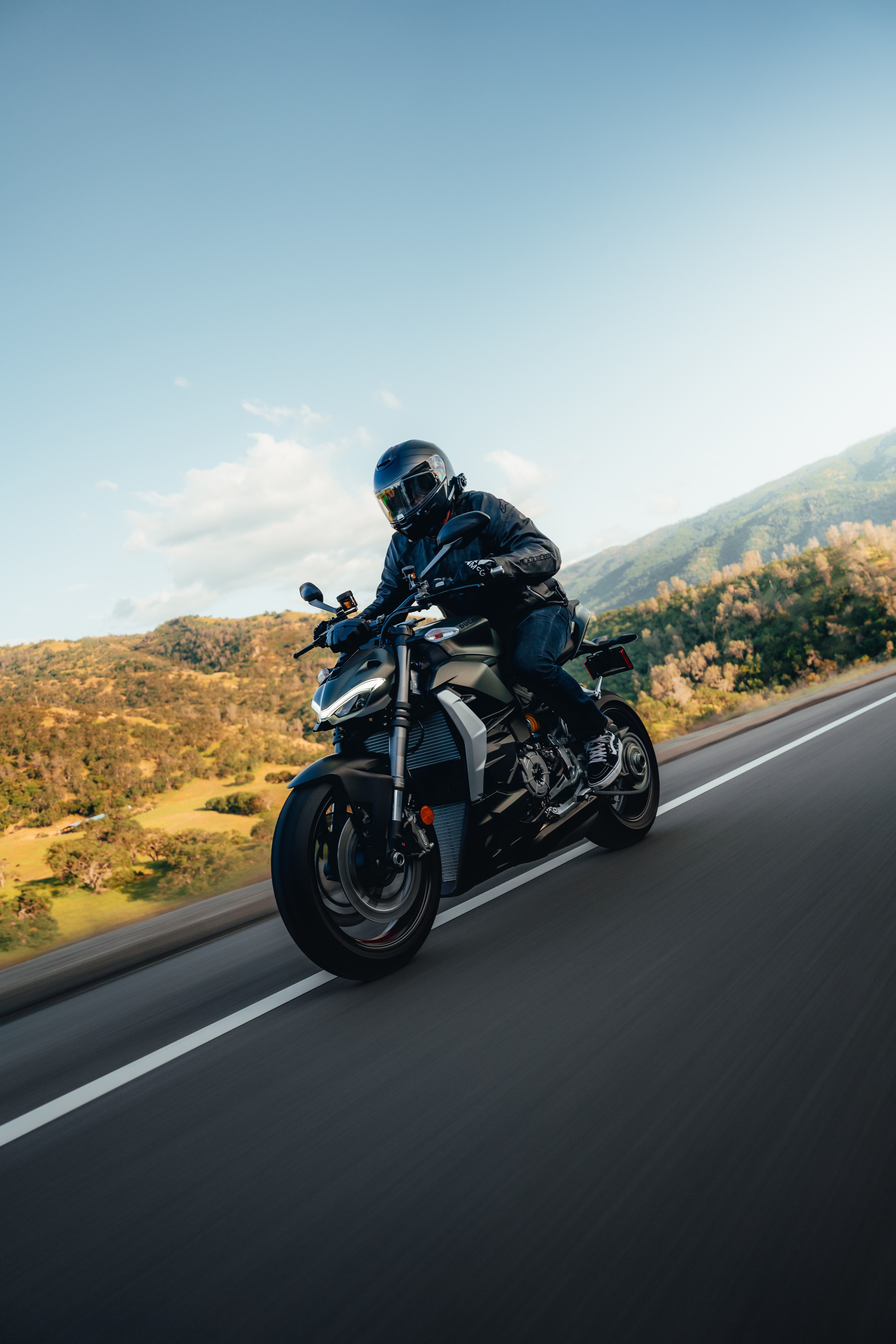 Ducati Street Fighter — rider close, golden hour