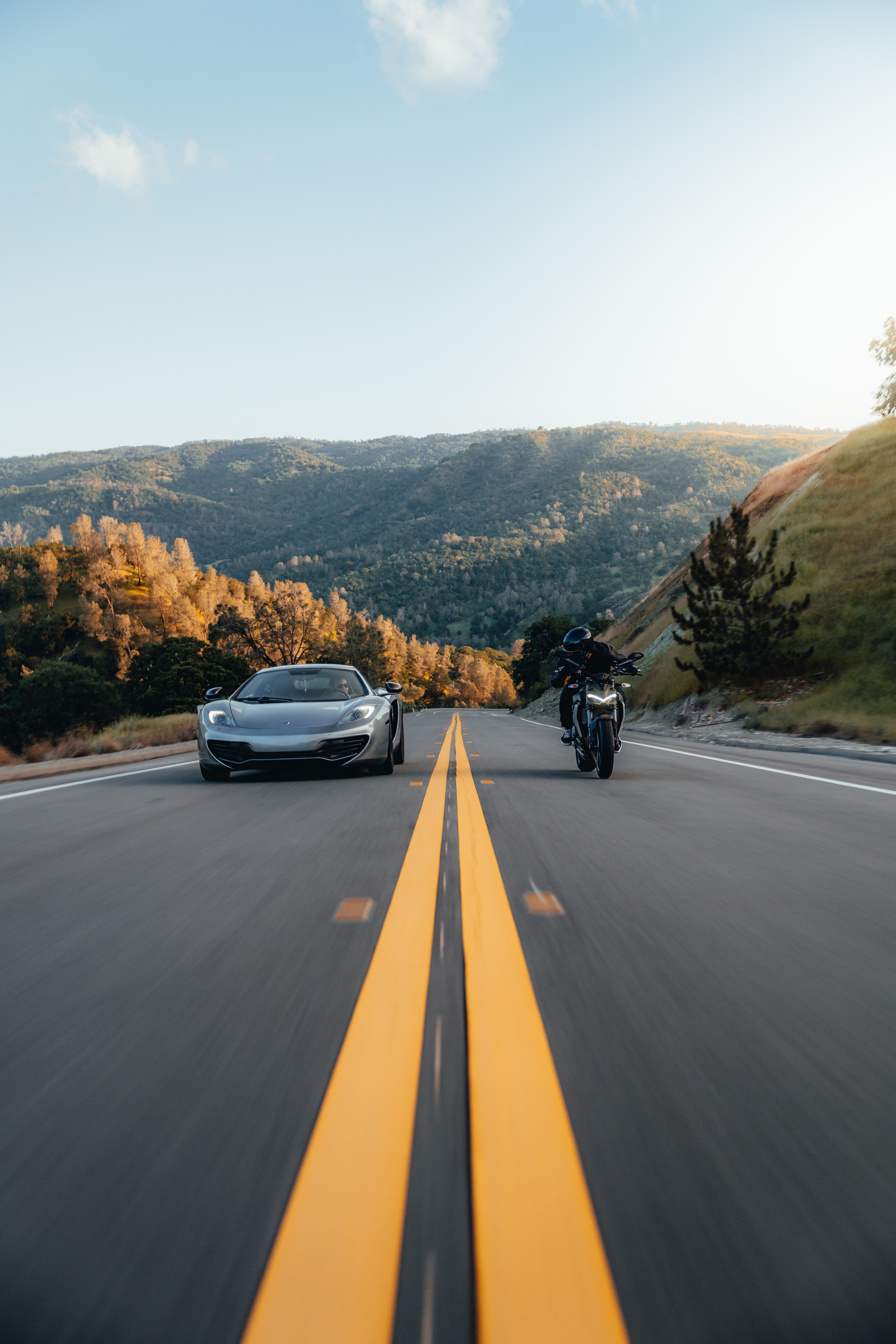 Ducati Street Fighter — rider, side, in motion on California pavement