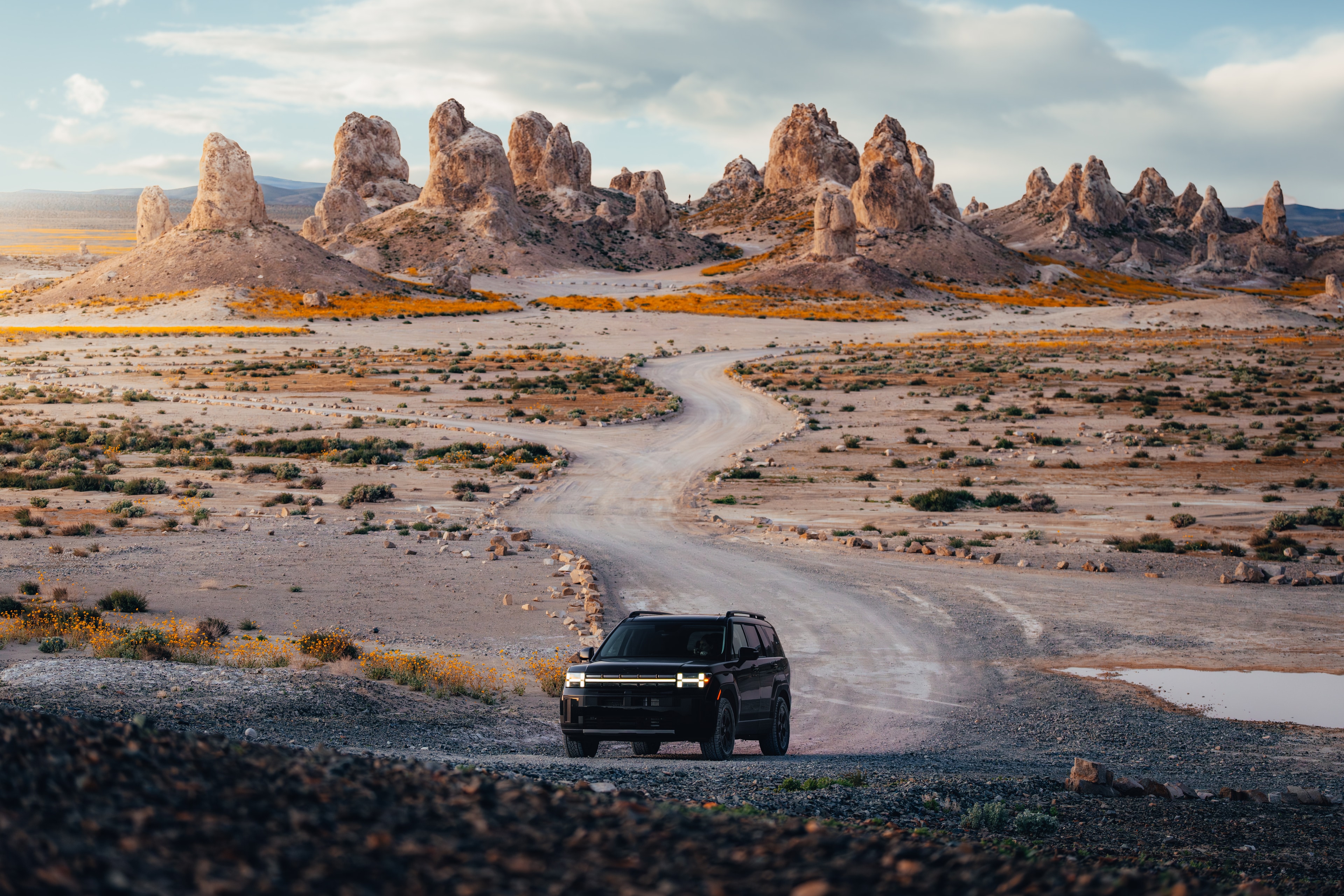 Hyundai Santa Fe on a winding desert road through the Trona pinnacles