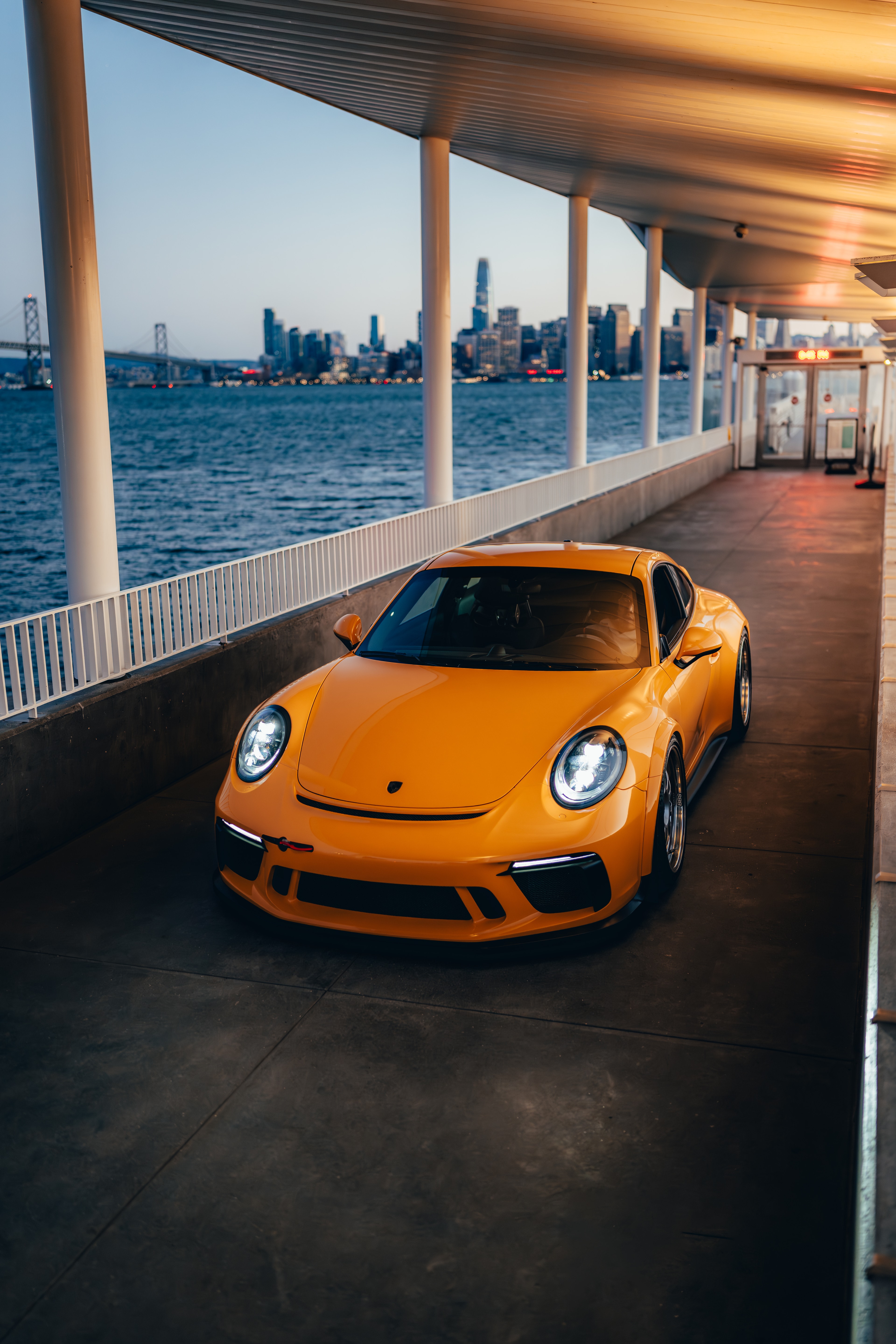 911 GT3 on Treasure Island at dusk, Bay Bridge behind