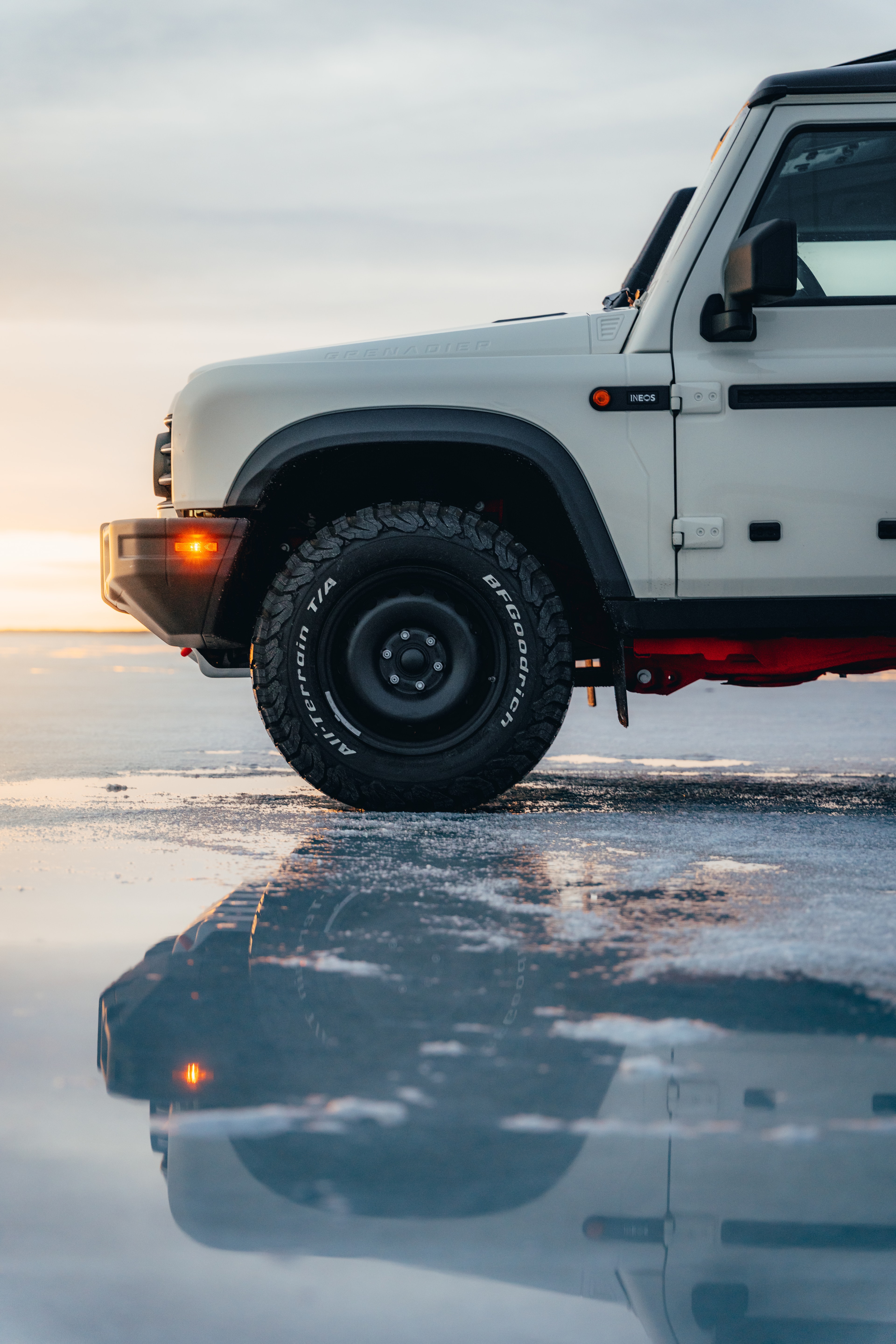 Front and wheel detail of the Quartermaster reflected in the wet salt at dusk